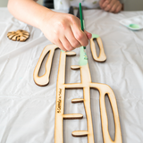Cactrella BARE trellis being painted with lime green paint