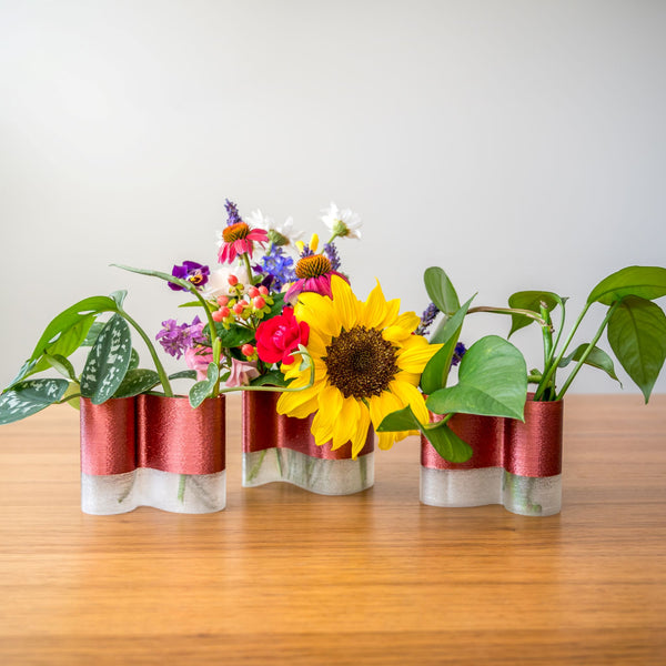set of 3 mini vase on a table with leaf cuttings and flowers